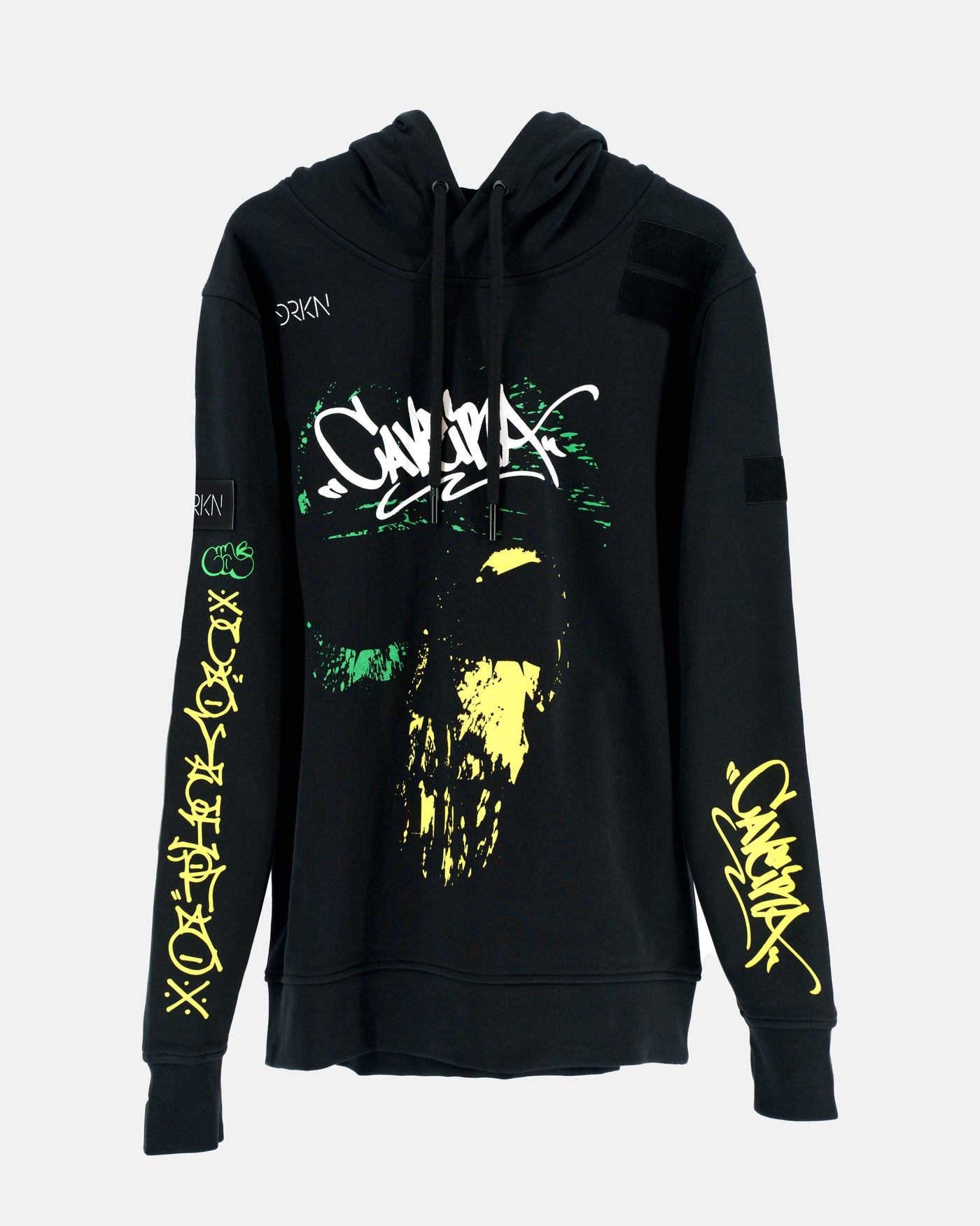 Black hoodie with a white, green and yellow grafiti print. Tribute to the operator Caveira from the game Rainbow Six.