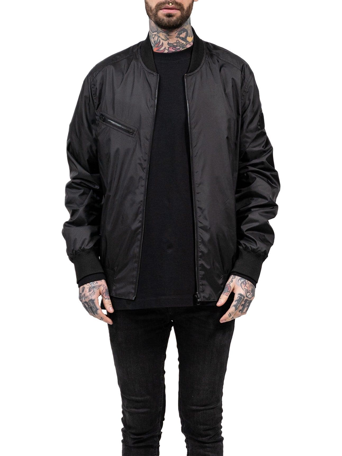 A reversible bomber jacket in black and reflective. 2 jackets in 1. 